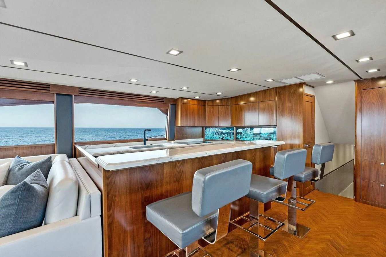 a large room with a large window and a view of the ocean aboard TEAM MAYHEM Yacht for Sale