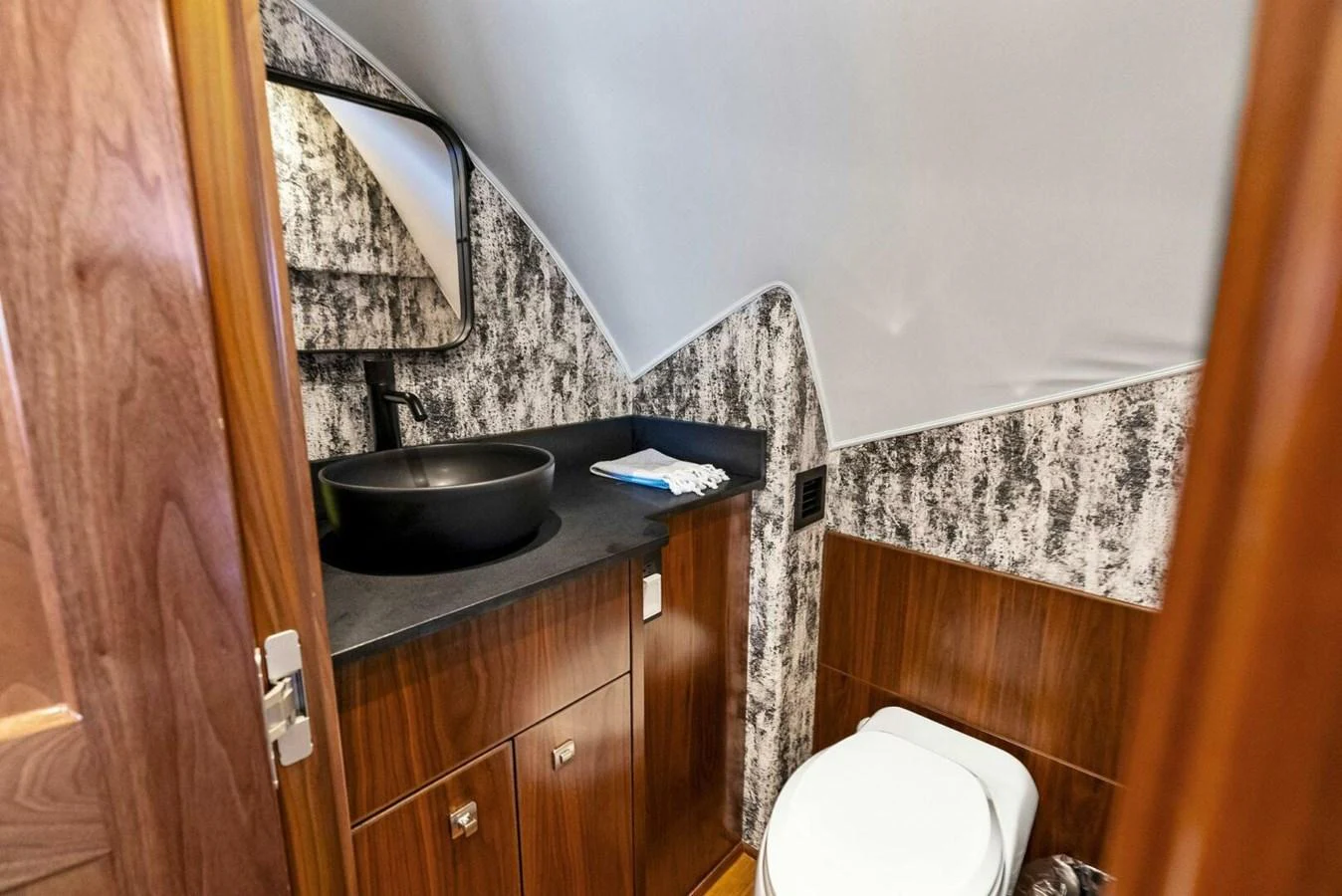 a bathroom with a sink and toilet aboard TEAM MAYHEM Yacht for Sale