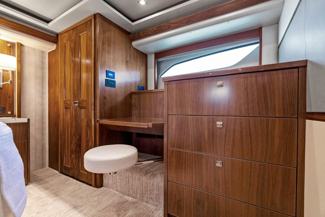 a bathroom with wood cabinets aboard TEAM MAYHEM Yacht for Sale