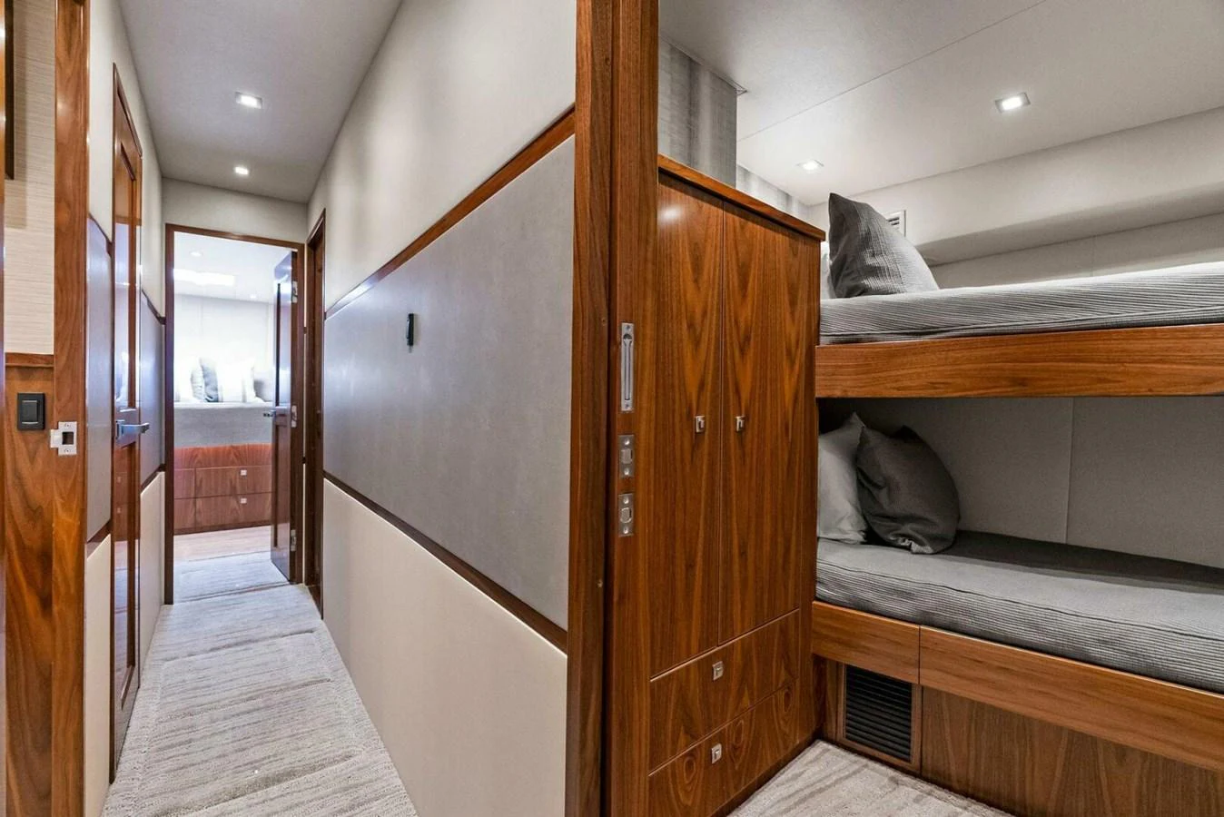 a cat sitting on a bed aboard TEAM MAYHEM Yacht for Sale