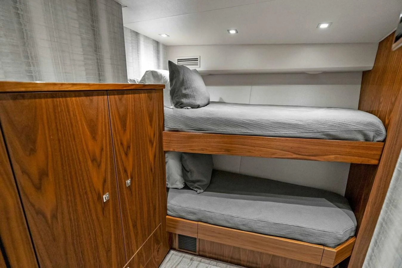 a cat lying on a bench aboard TEAM MAYHEM Yacht for Sale