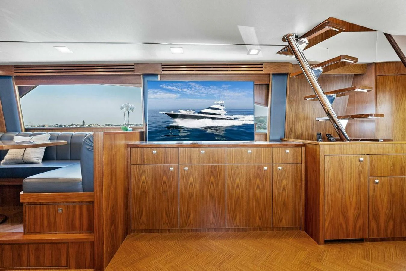 a room with a large screen aboard TEAM MAYHEM Yacht for Sale