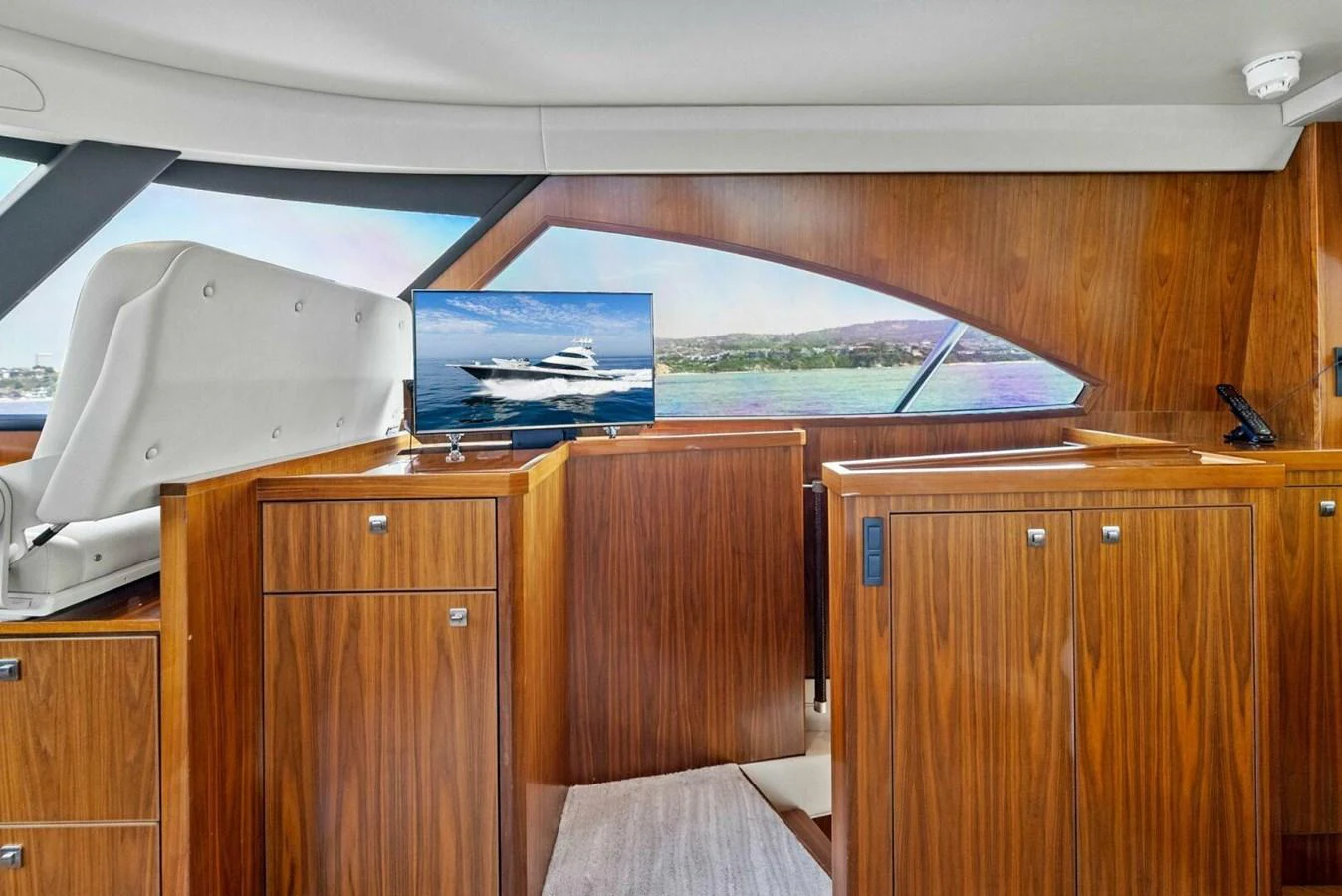 a boat in a wooden room aboard TEAM MAYHEM Yacht for Sale