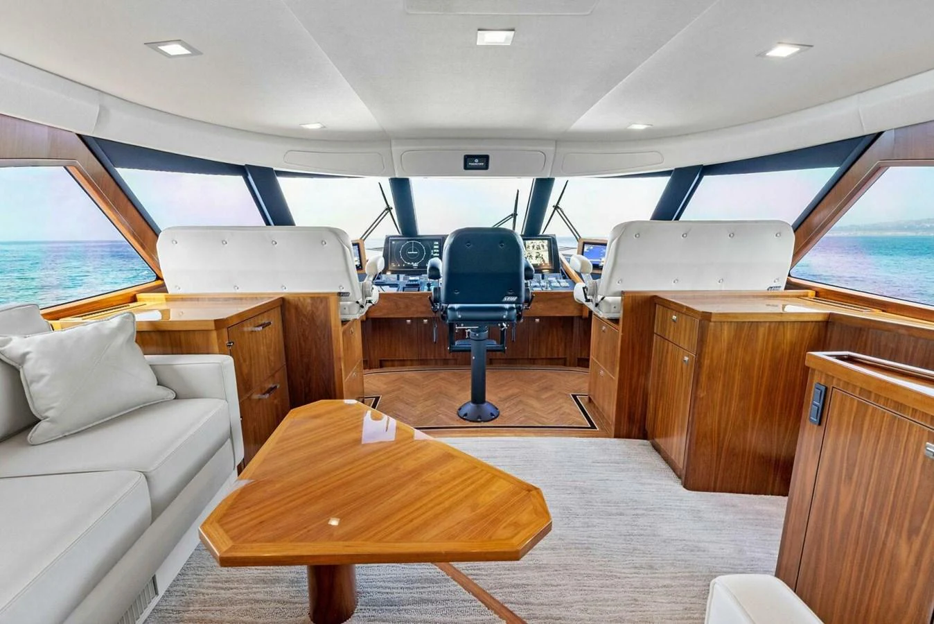 a room with a table and chairs aboard TEAM MAYHEM Yacht for Sale