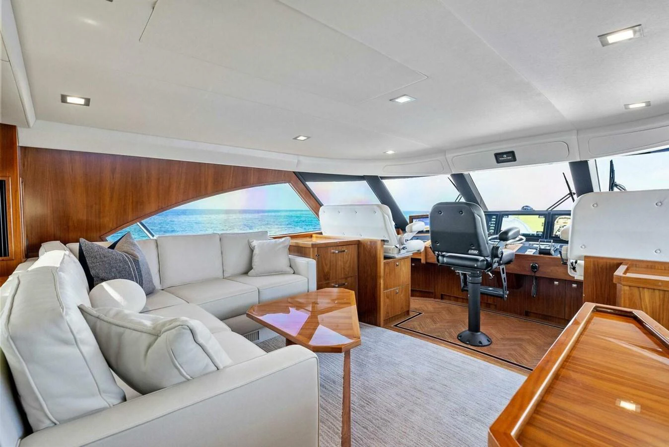 a living room with a large bed aboard TEAM MAYHEM Yacht for Sale