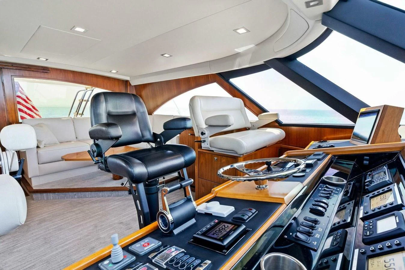 a room with a desk and chairs aboard TEAM MAYHEM Yacht for Sale