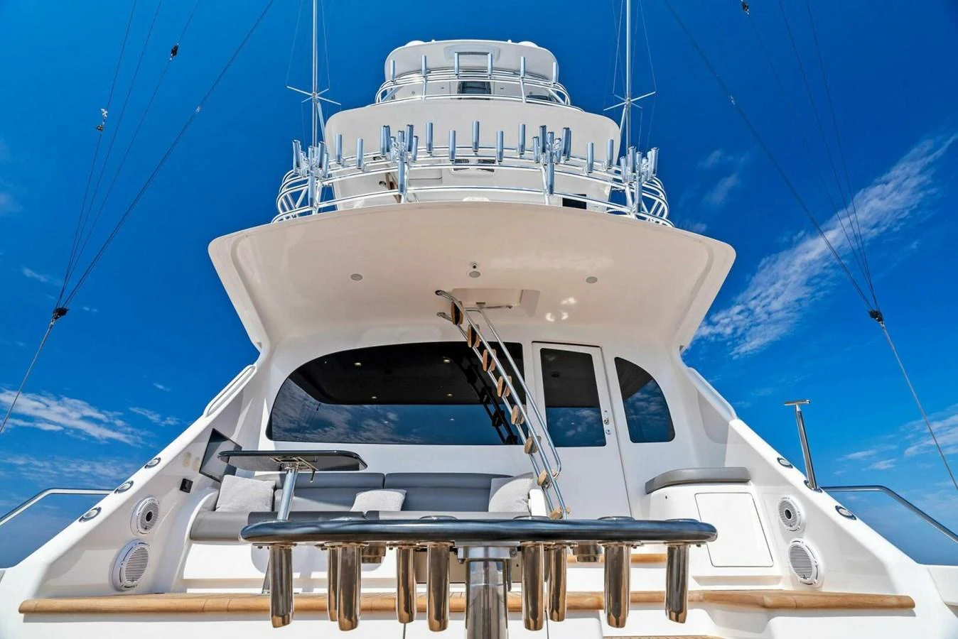 a white boat on a body of water aboard TEAM MAYHEM Yacht for Sale