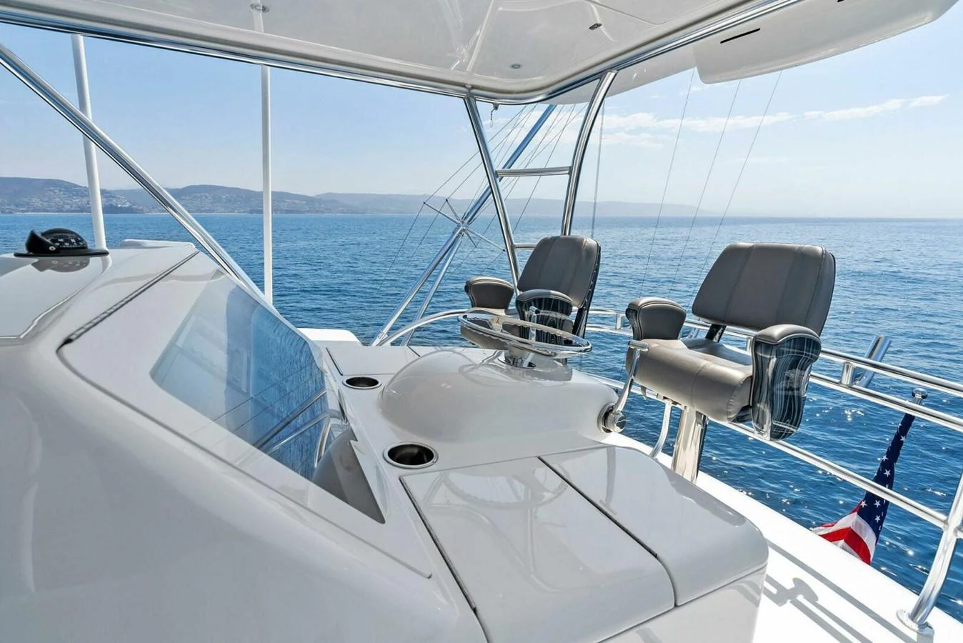 a boat with chairs on the deck aboard TEAM MAYHEM Yacht for Sale