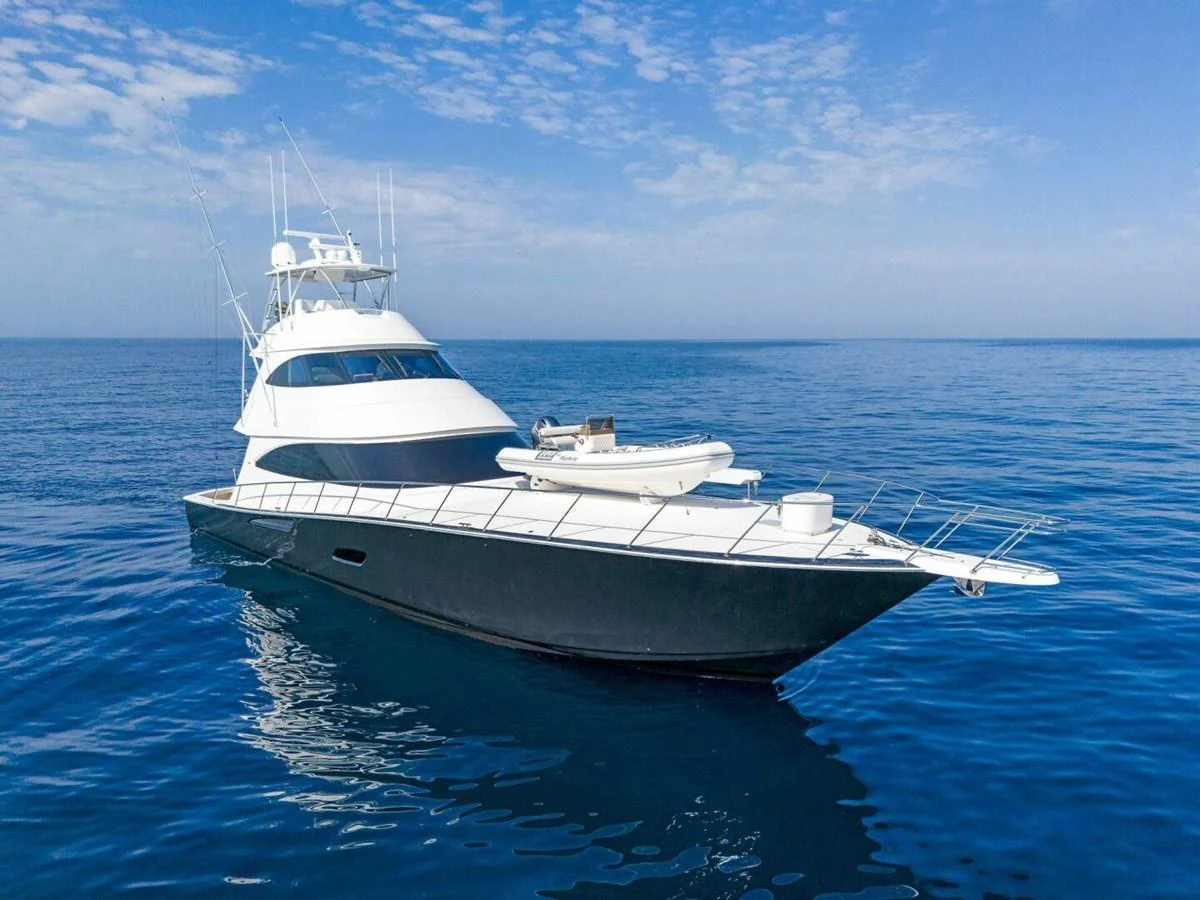 a white yacht in the water aboard TEAM MAYHEM Yacht for Sale