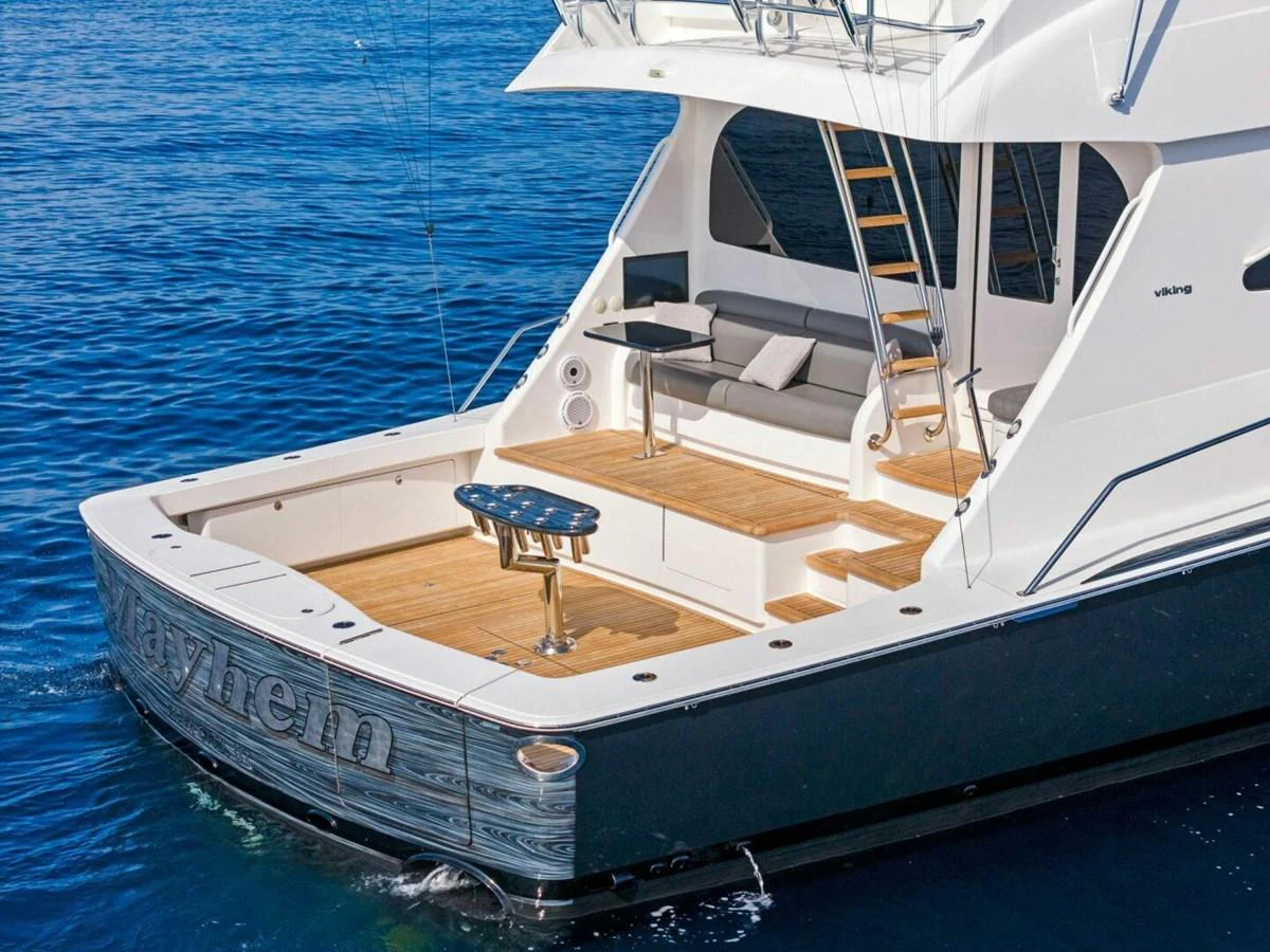 a white boat on the water aboard TEAM MAYHEM Yacht for Sale