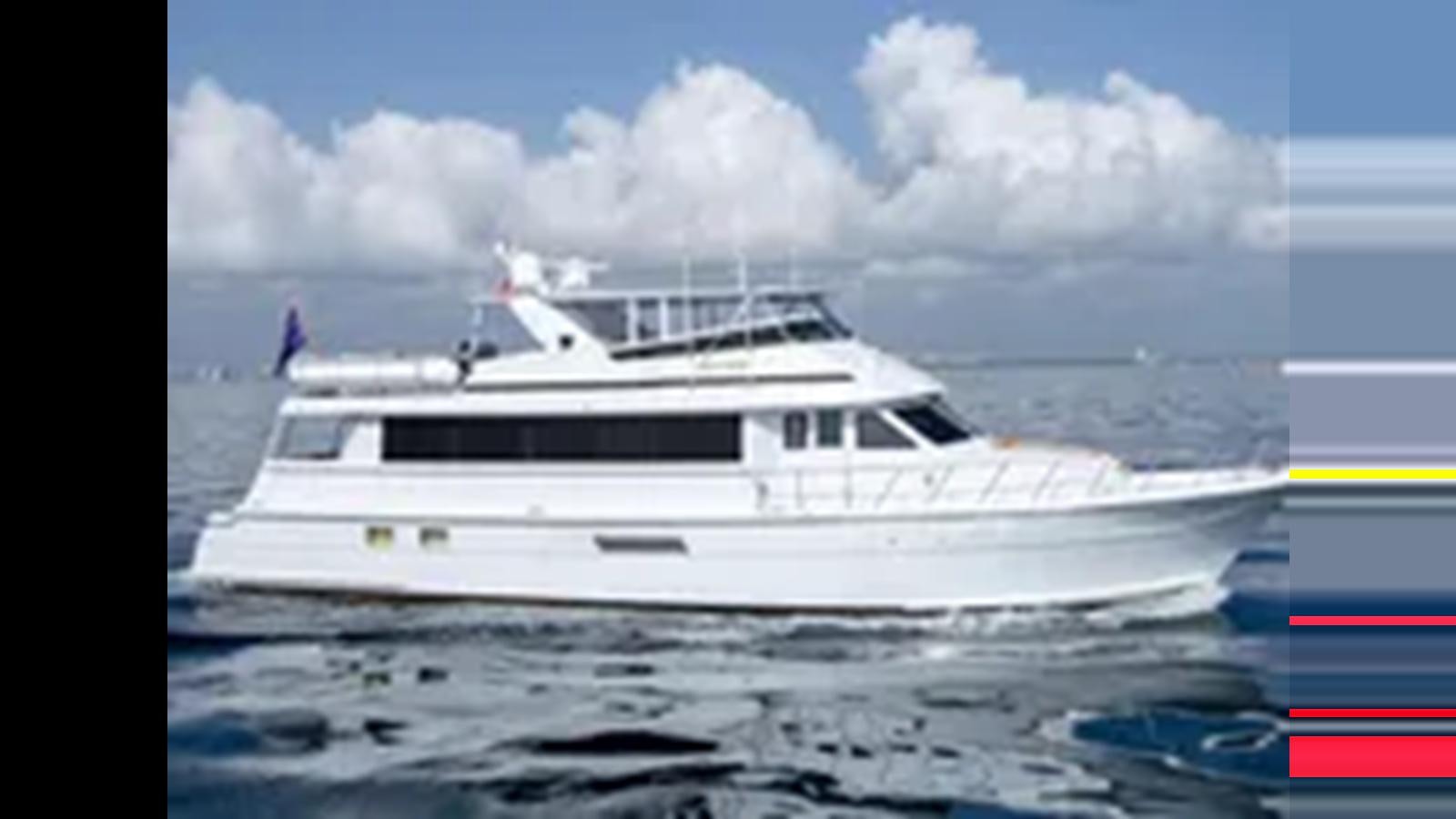 a white yacht in the water aboard 1999 HATTERAS 74 SPORT DECK MOTOR YACHT Yacht for Sale