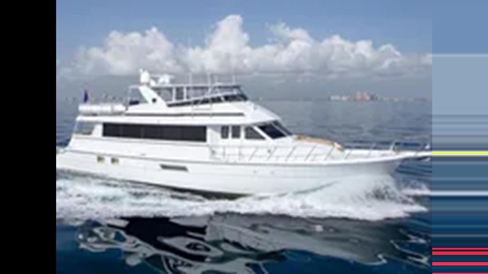a white yacht on the water aboard 1999 HATTERAS 74 SPORT DECK MOTOR YACHT Yacht for Sale