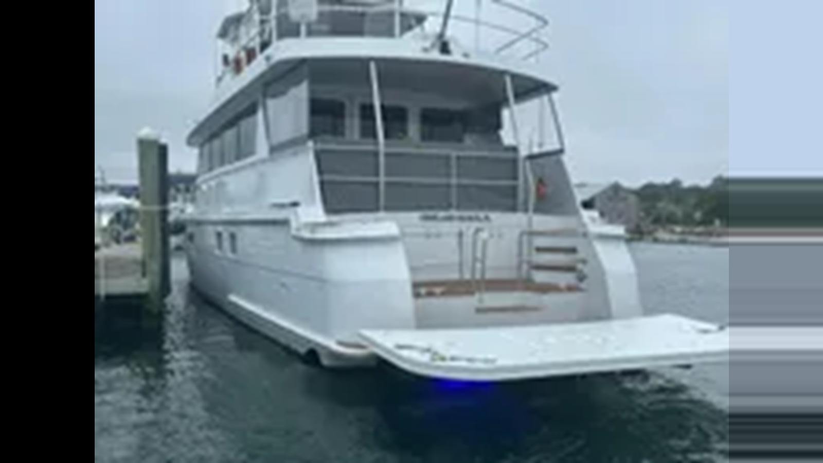 a boat in the water aboard 1999 HATTERAS 74 SPORT DECK MOTOR YACHT Yacht for Sale