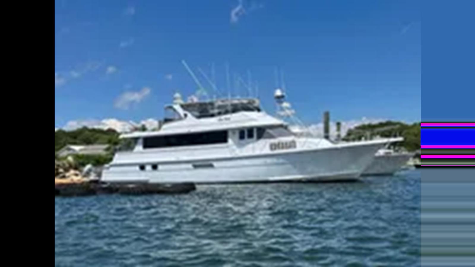 a boat on the water aboard 1999 HATTERAS 74 SPORT DECK MOTOR YACHT Yacht for Sale