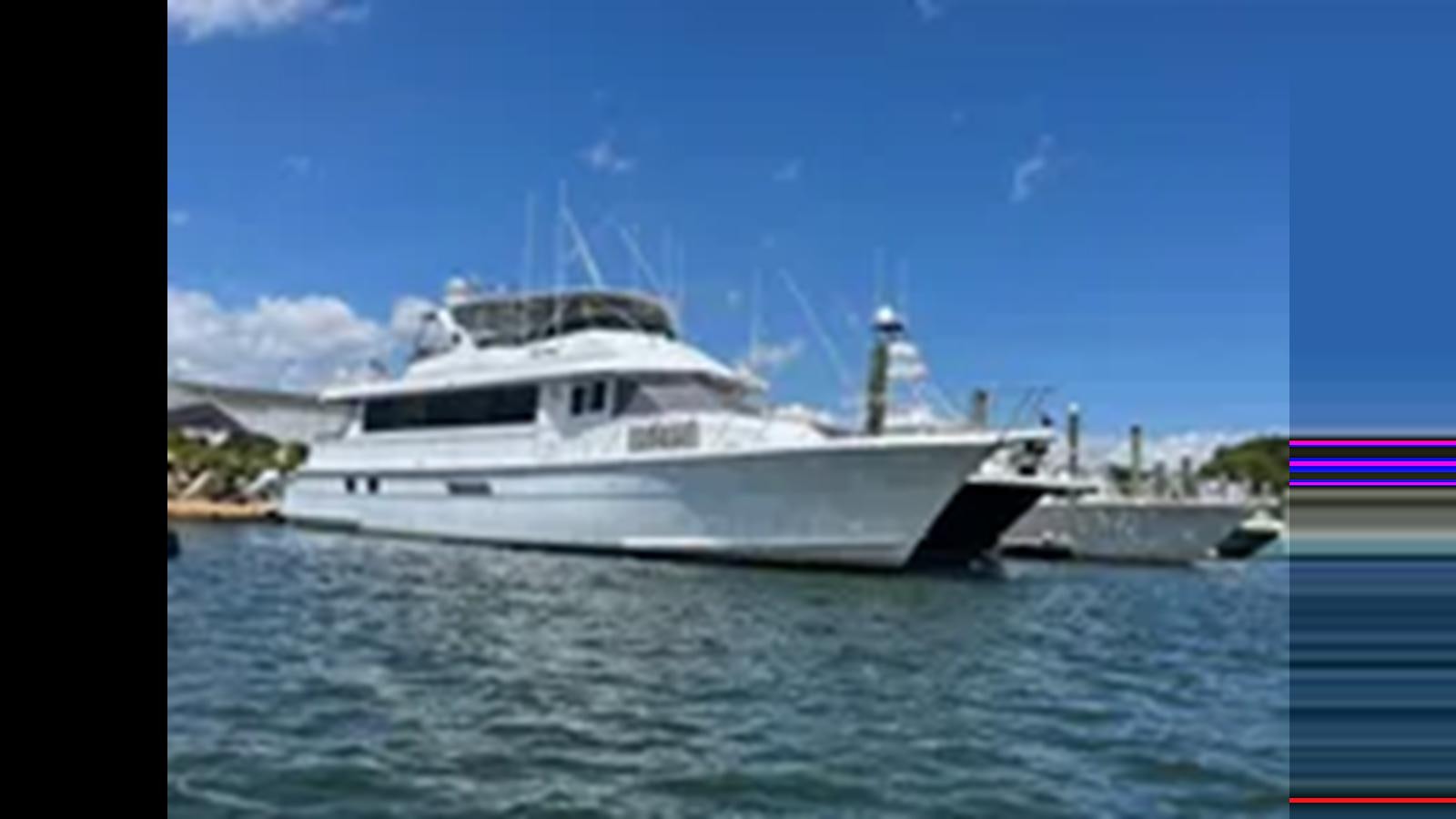 a boat on the water aboard 1999 HATTERAS 74 SPORT DECK MOTOR YACHT Yacht for Sale