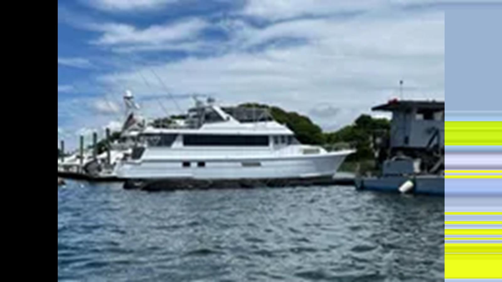 a boat on the water aboard 1999 HATTERAS 74 SPORT DECK MOTOR YACHT Yacht for Sale