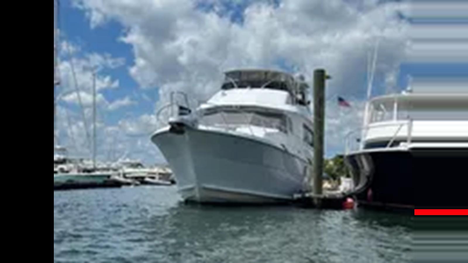 a boat on the water aboard 1999 HATTERAS 74 SPORT DECK MOTOR YACHT Yacht for Sale