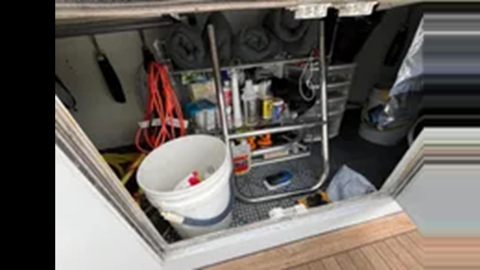 a white bucket in a white container aboard 1999 HATTERAS 74 SPORT DECK MOTOR YACHT Yacht for Sale