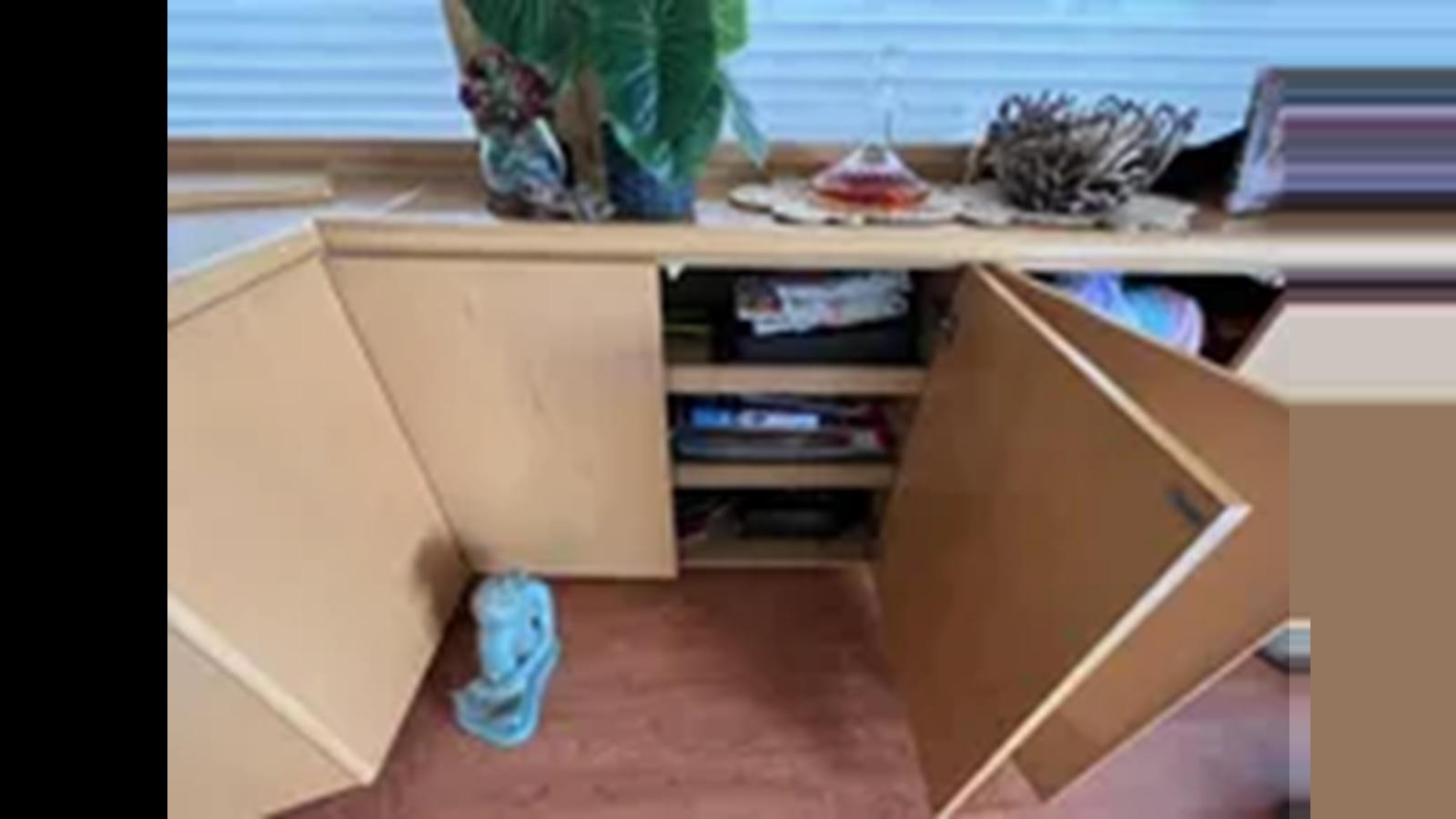 a desk with a cat on it aboard 1999 HATTERAS 74 SPORT DECK MOTOR YACHT Yacht for Sale