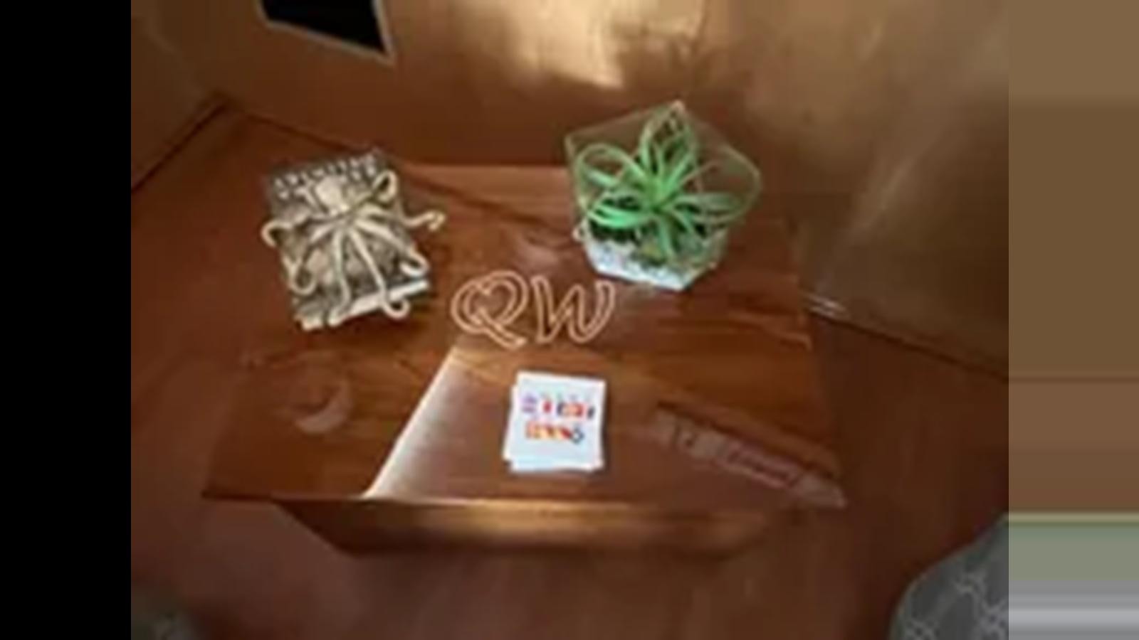 a small green tree on a wooden table aboard 1999 HATTERAS 74 SPORT DECK MOTOR YACHT Yacht for Sale