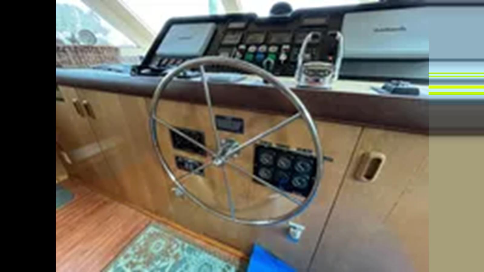a close-up of a guitar aboard 1999 HATTERAS 74 SPORT DECK MOTOR YACHT Yacht for Sale