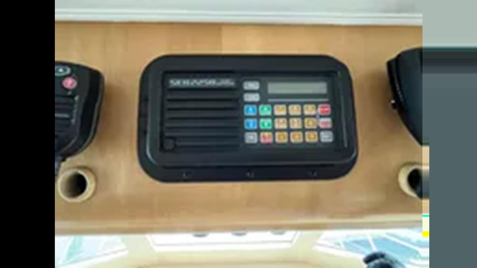 a black rectangular electronic device aboard 1999 HATTERAS 74 SPORT DECK MOTOR YACHT Yacht for Sale