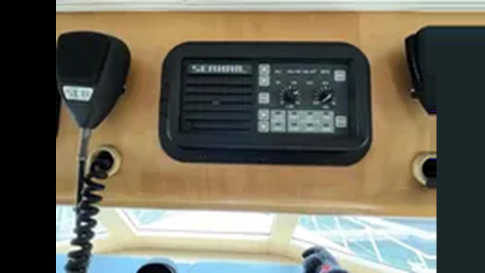 a black and silver electronic device aboard 1999 HATTERAS 74 SPORT DECK MOTOR YACHT Yacht for Sale