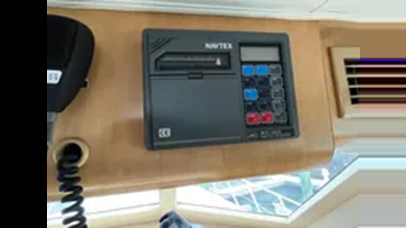 a black rectangular device with a screen aboard 1999 HATTERAS 74 SPORT DECK MOTOR YACHT Yacht for Sale