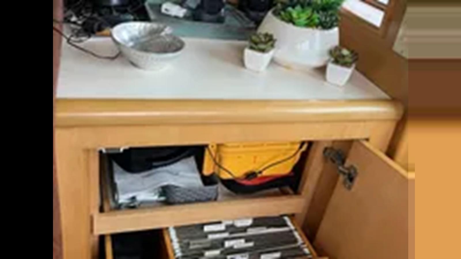 a shelf with a sink and a shelf with objects on it aboard 1999 HATTERAS 74 SPORT DECK MOTOR YACHT Yacht for Sale