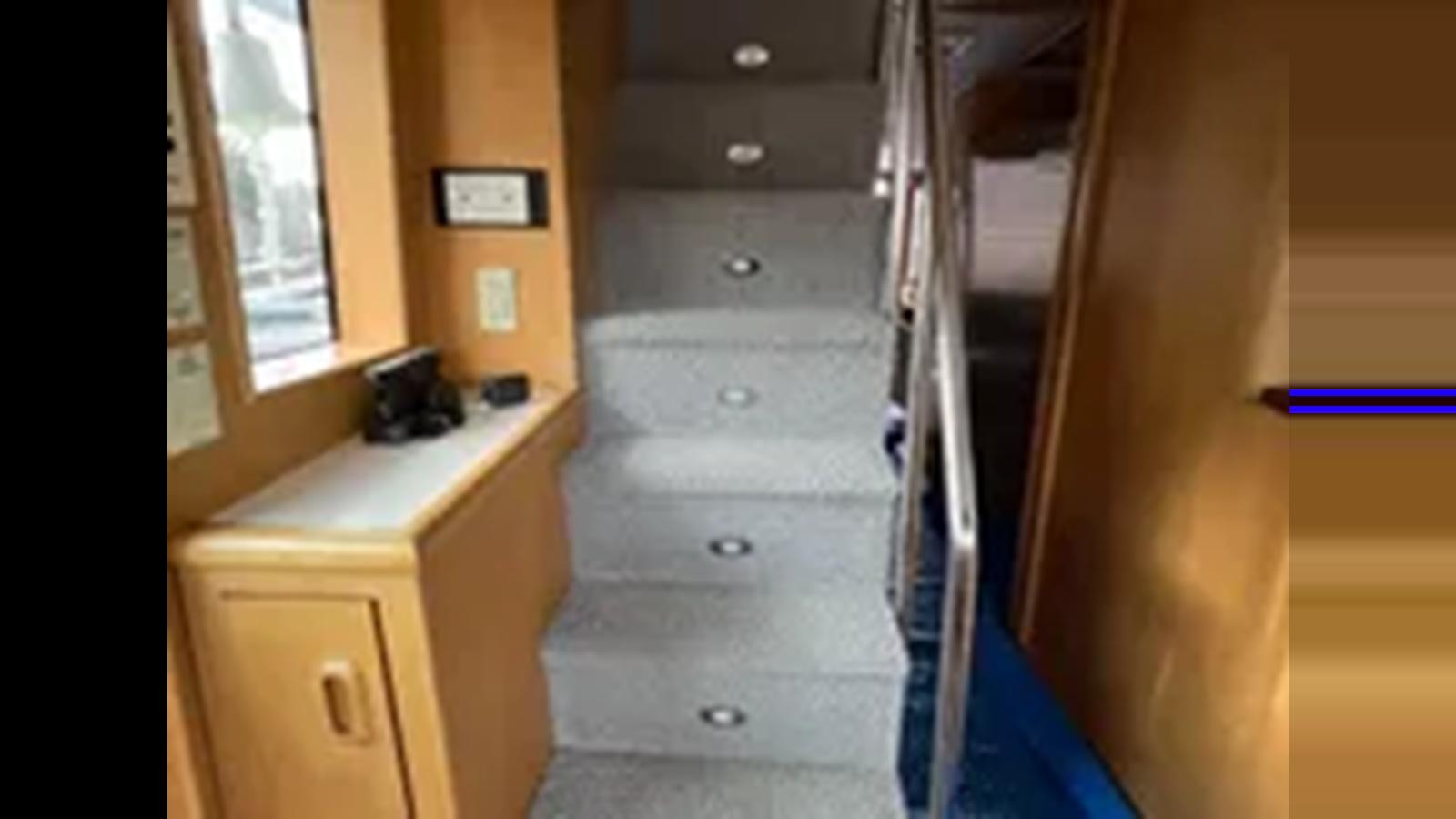 a dresser in a room aboard 1999 HATTERAS 74 SPORT DECK MOTOR YACHT Yacht for Sale