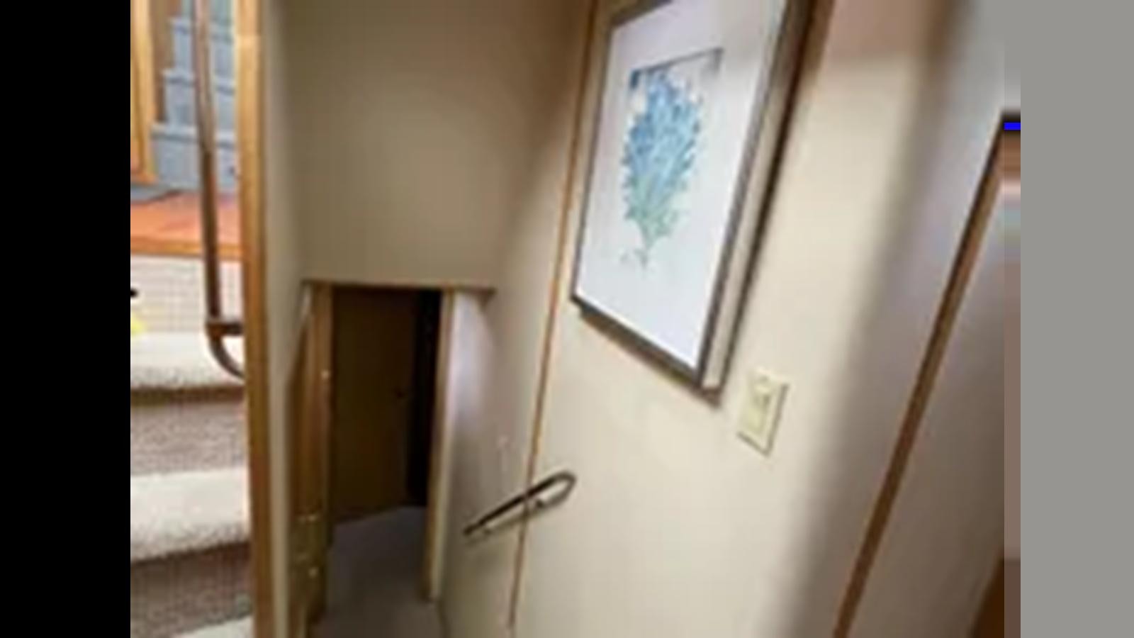 a door with a painting on it aboard 1999 HATTERAS 74 SPORT DECK MOTOR YACHT Yacht for Sale