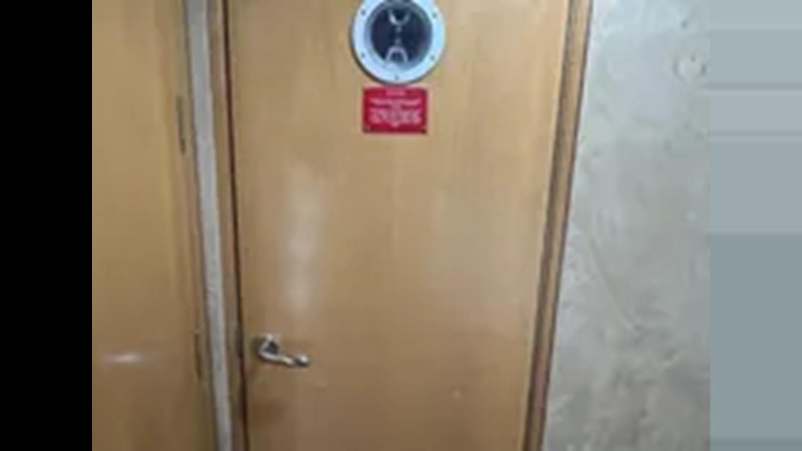 a door with a red button aboard 1999 HATTERAS 74 SPORT DECK MOTOR YACHT Yacht for Sale