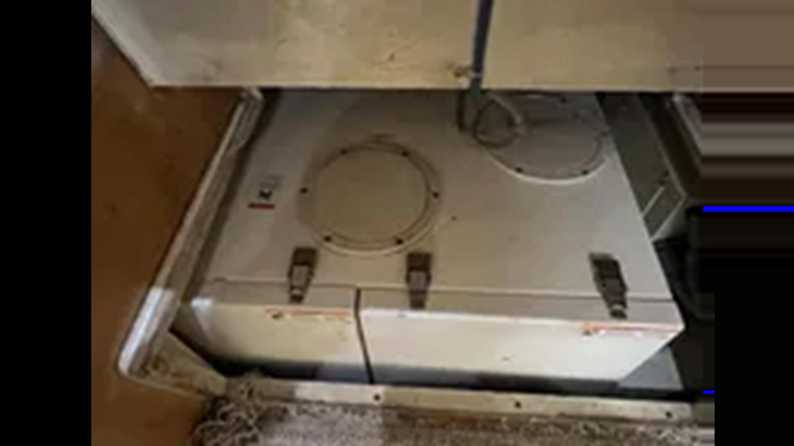 a metal box with a circular object inside aboard 1999 HATTERAS 74 SPORT DECK MOTOR YACHT Yacht for Sale