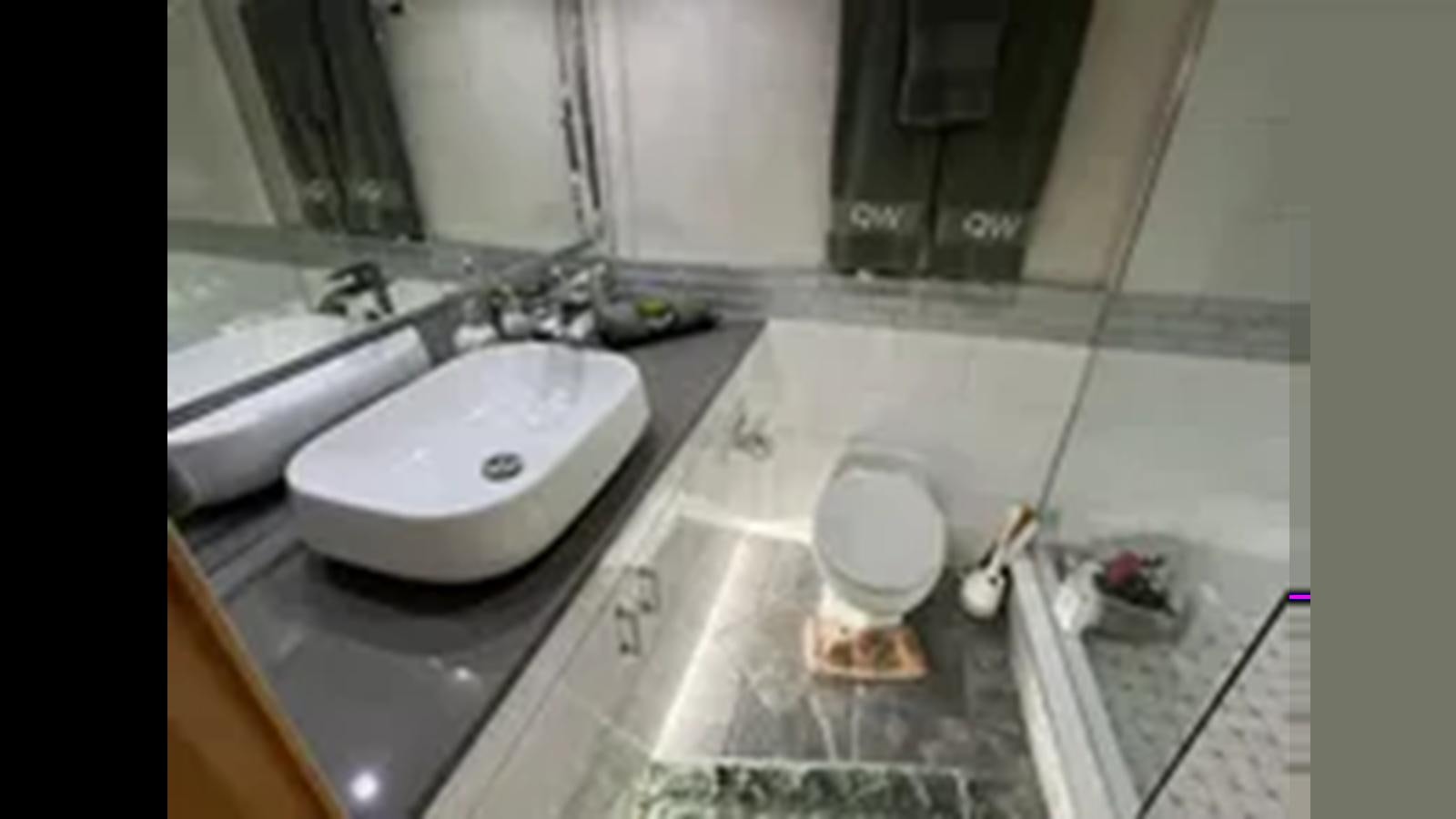 a bathroom with a sink and a toilet aboard 1999 HATTERAS 74 SPORT DECK MOTOR YACHT Yacht for Sale