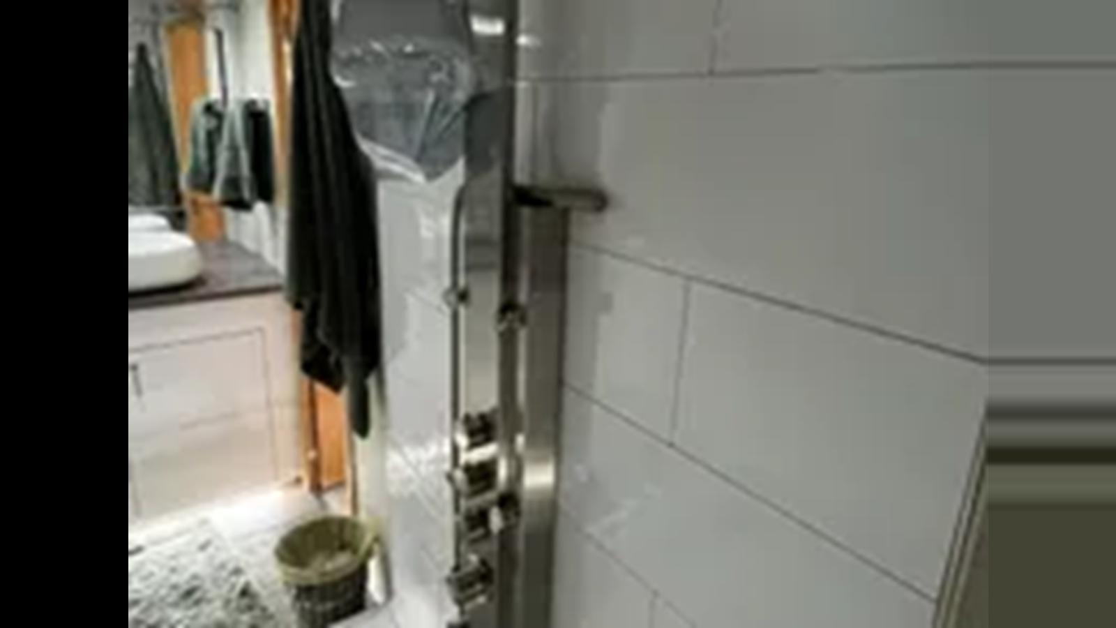 a shower unit in a bathroom aboard 1999 HATTERAS 74 SPORT DECK MOTOR YACHT Yacht for Sale