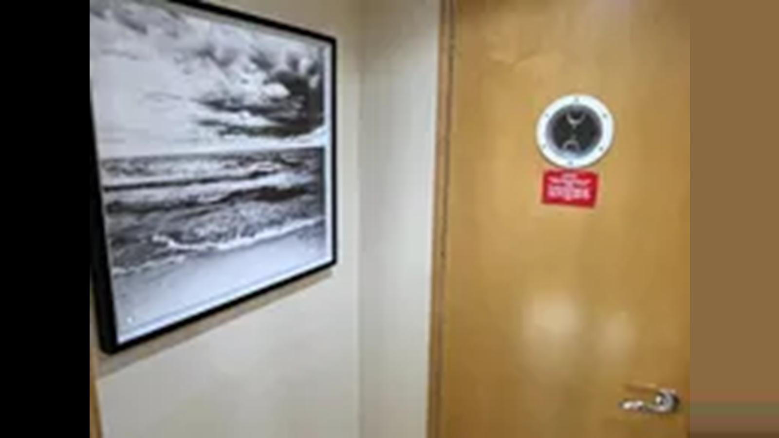 a door with a picture on it aboard 1999 HATTERAS 74 SPORT DECK MOTOR YACHT Yacht for Sale