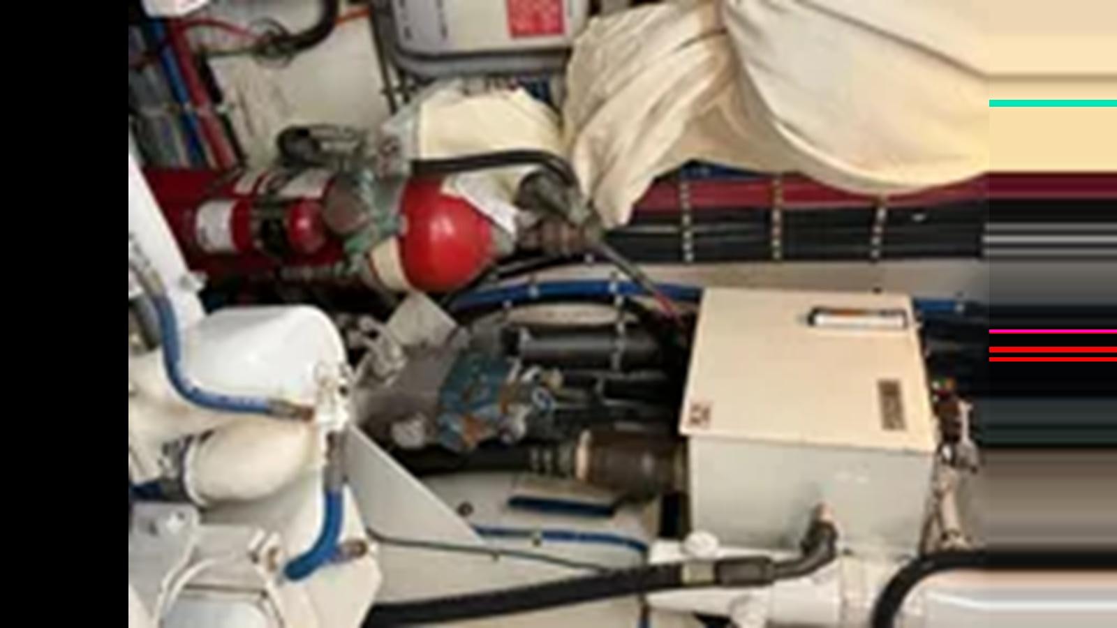 a machine with wires aboard 1999 HATTERAS 74 SPORT DECK MOTOR YACHT Yacht for Sale