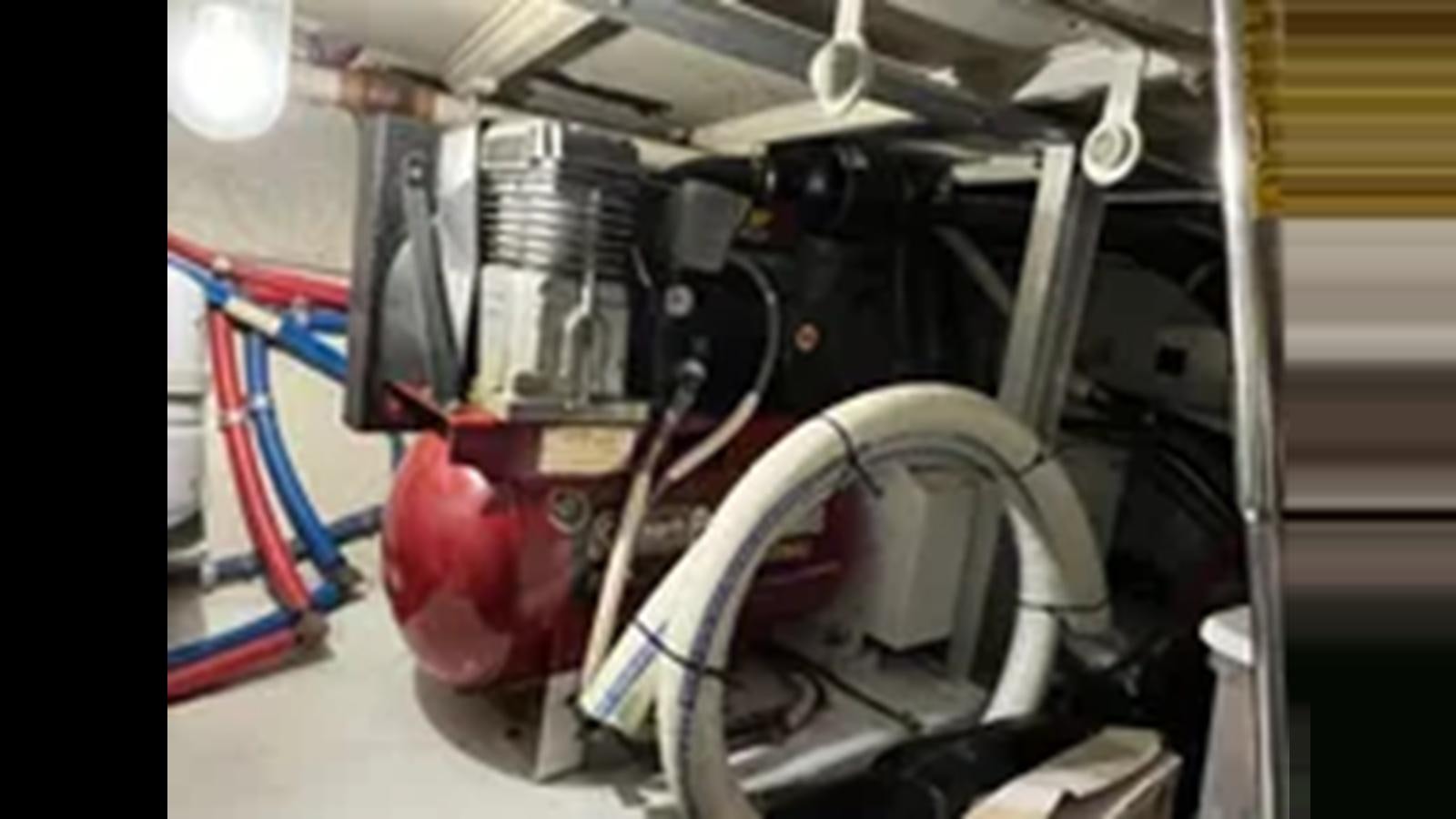 a close-up of a car engine aboard 1999 HATTERAS 74 SPORT DECK MOTOR YACHT Yacht for Sale