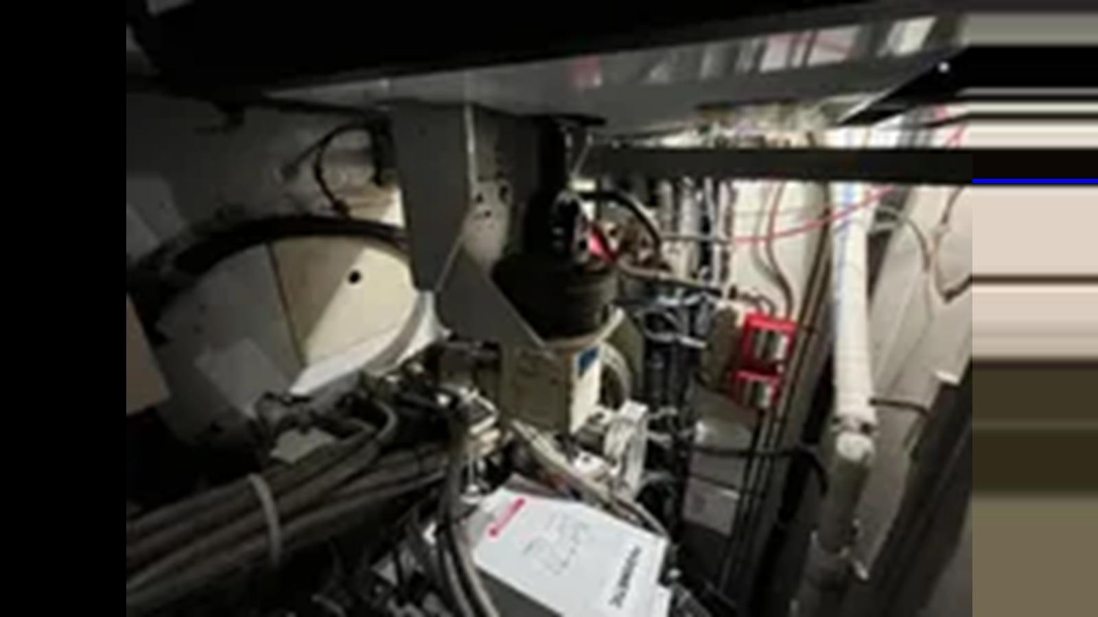 a close-up of a car engine aboard 1999 HATTERAS 74 SPORT DECK MOTOR YACHT Yacht for Sale