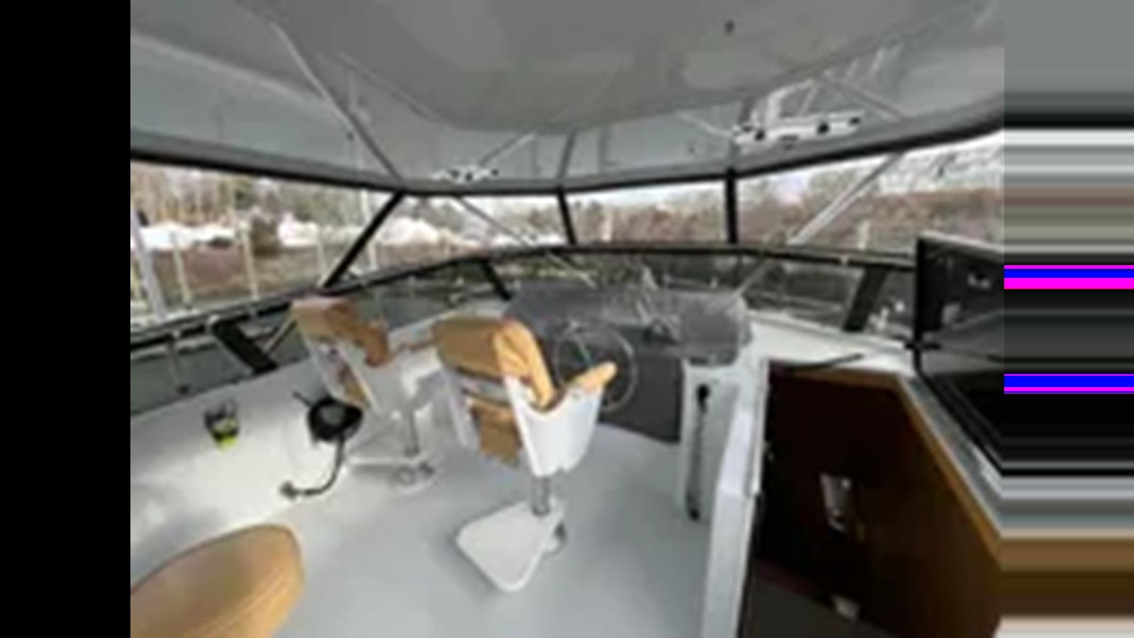a room with a table and chairs aboard 1999 HATTERAS 74 SPORT DECK MOTOR YACHT Yacht for Sale