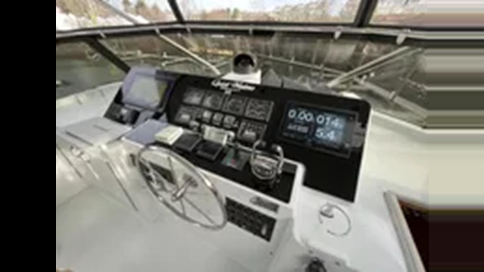 a group of electronic devices aboard 1999 HATTERAS 74 SPORT DECK MOTOR YACHT Yacht for Sale