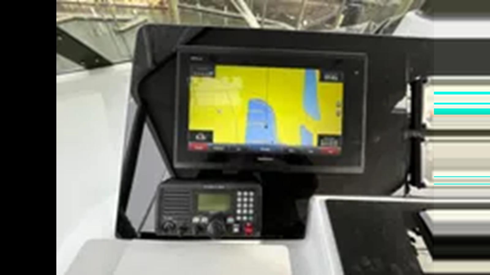 a computer with a screen aboard 1999 HATTERAS 74 SPORT DECK MOTOR YACHT Yacht for Sale