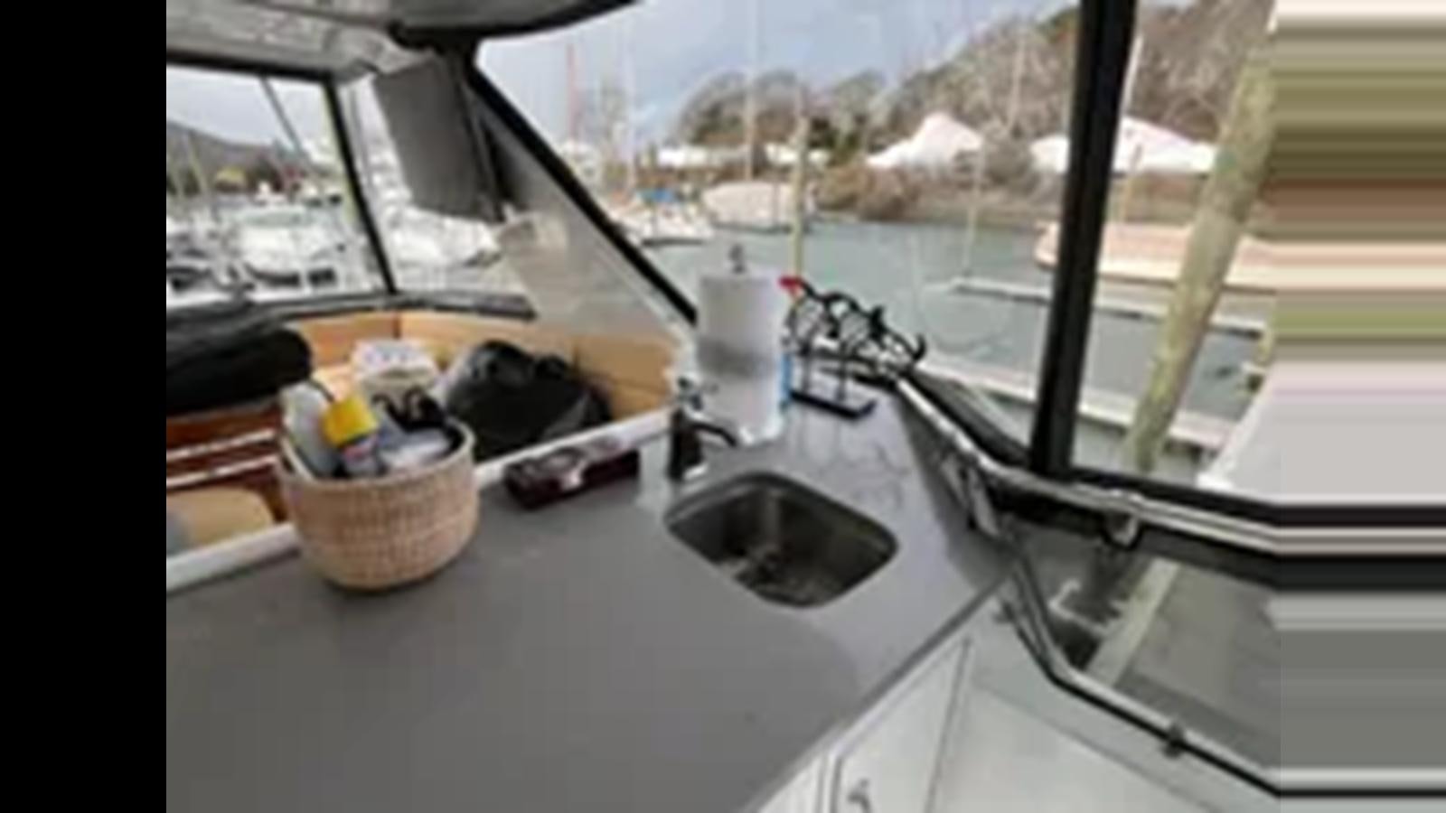 a sink with a faucet aboard 1999 HATTERAS 74 SPORT DECK MOTOR YACHT Yacht for Sale