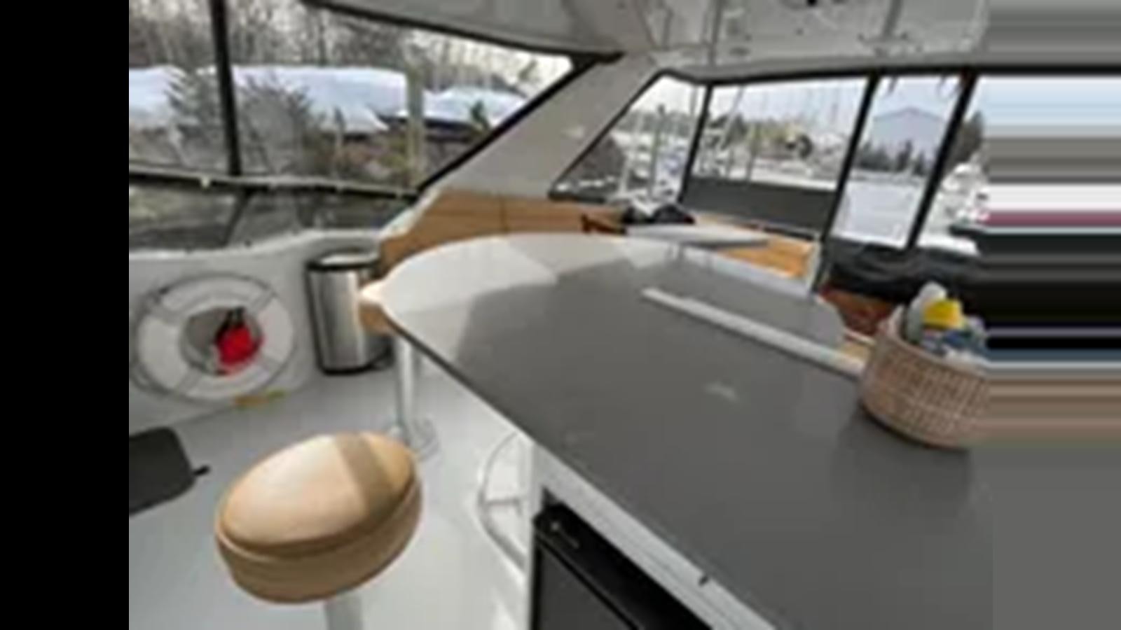 a white car with a spoon in it aboard 1999 HATTERAS 74 SPORT DECK MOTOR YACHT Yacht for Sale