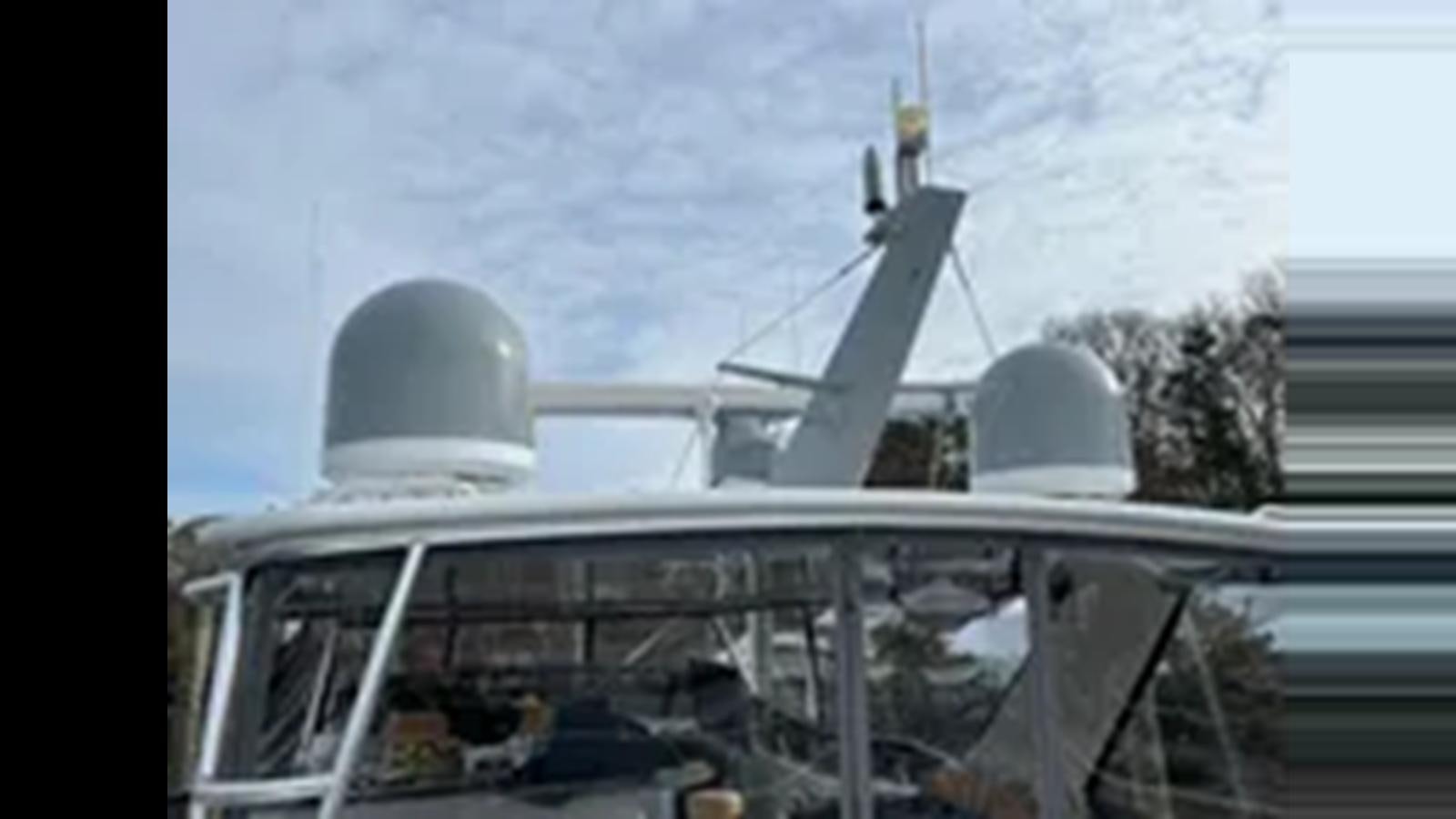 a plane on a snowy day aboard 1999 HATTERAS 74 SPORT DECK MOTOR YACHT Yacht for Sale