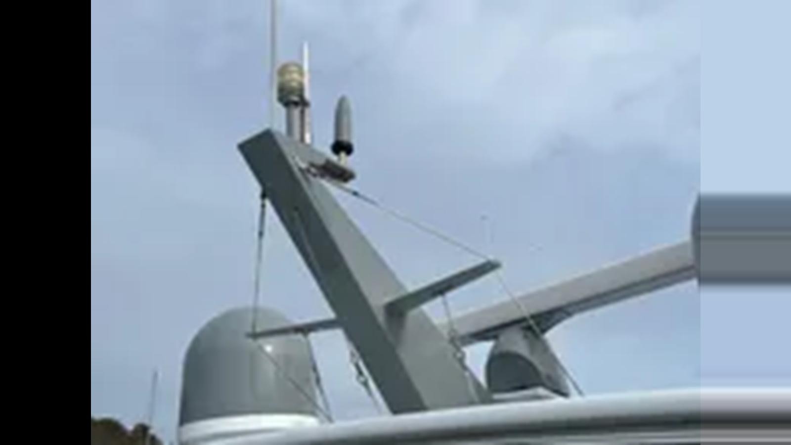 a close-up of a white wind turbine aboard 1999 HATTERAS 74 SPORT DECK MOTOR YACHT Yacht for Sale