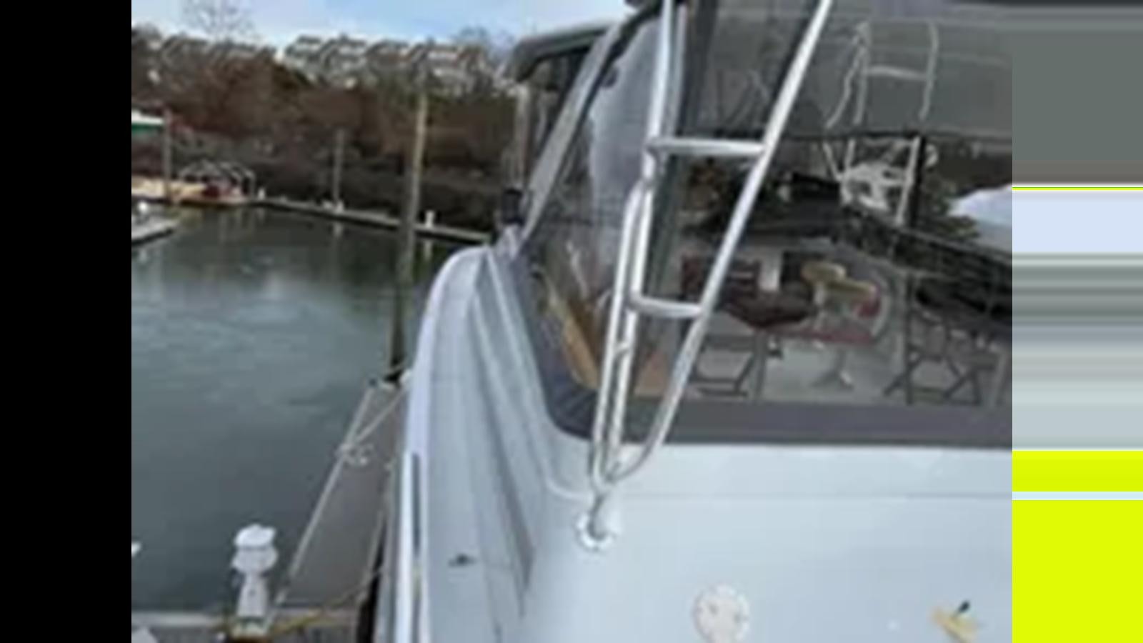 a white car with a broken front window aboard 1999 HATTERAS 74 SPORT DECK MOTOR YACHT Yacht for Sale