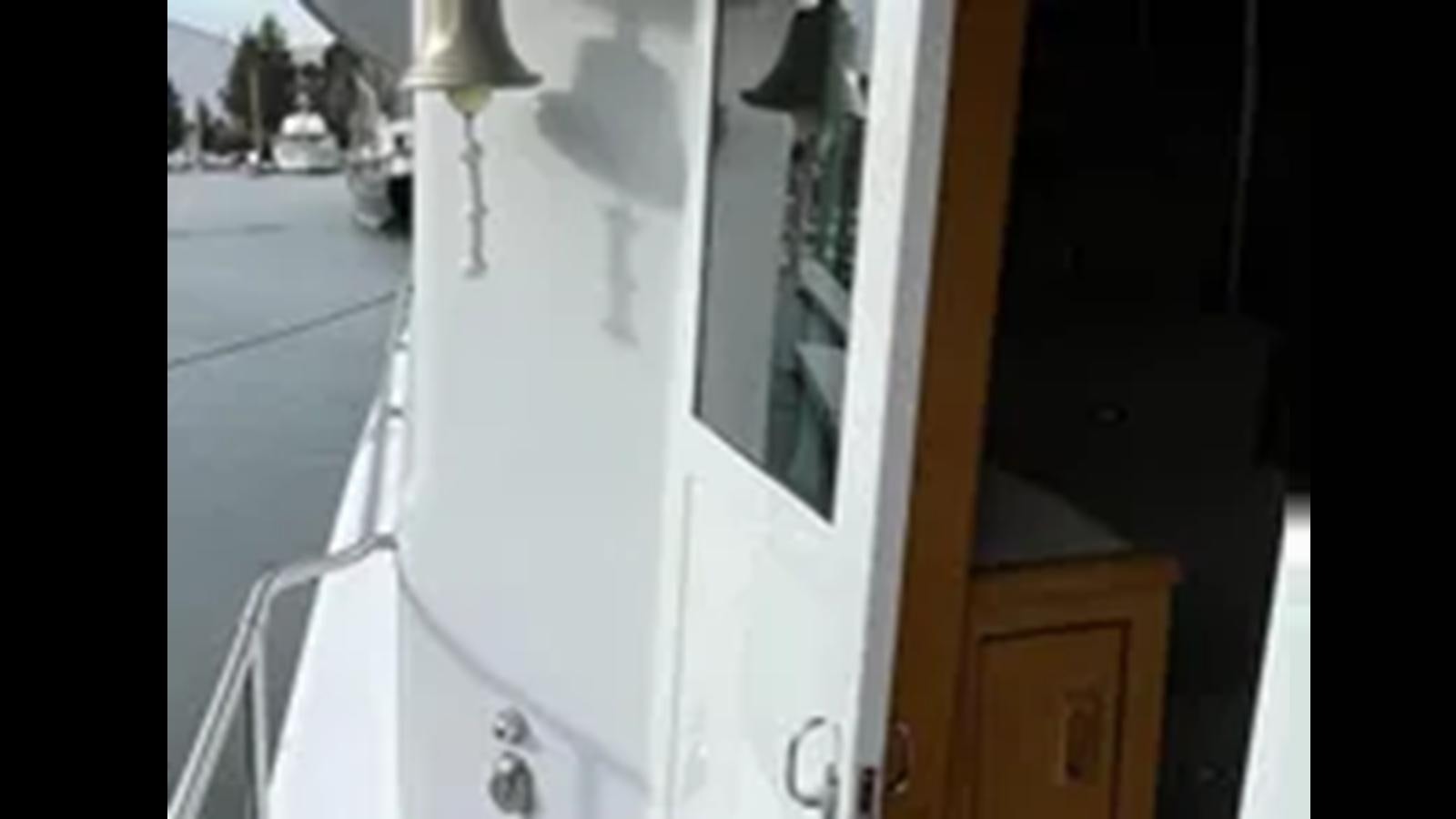 a white door with a white door aboard 1999 HATTERAS 74 SPORT DECK MOTOR YACHT Yacht for Sale