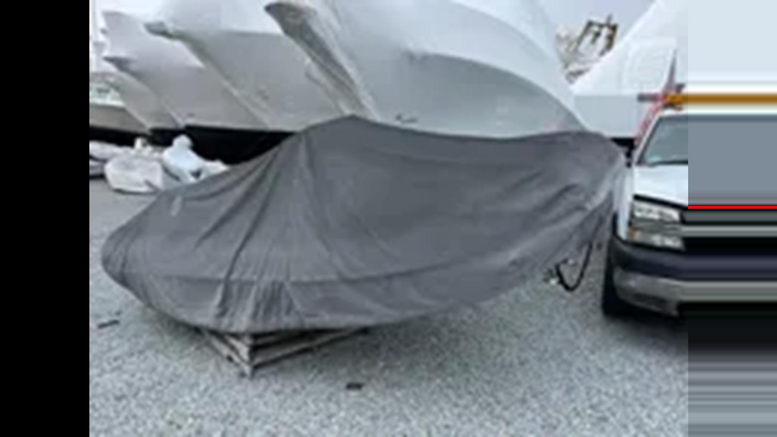 a white car with a dent in it aboard 1999 HATTERAS 74 SPORT DECK MOTOR YACHT Yacht for Sale