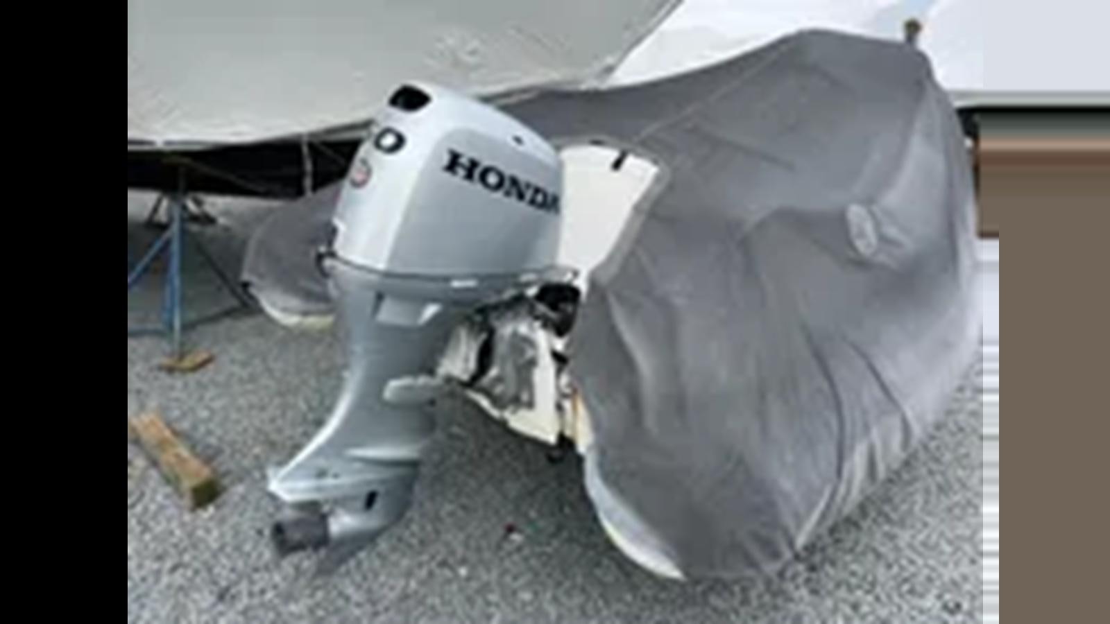 a white robot with a black handle aboard 1999 HATTERAS 74 SPORT DECK MOTOR YACHT Yacht for Sale